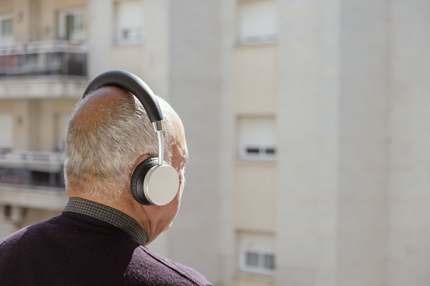 old caucasian man using headphones