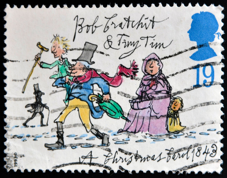 UNITED KINGDOM - CIRCA 1993: A stamp printed in Great Britain dedicated to Christmas shows Bob Cratchit and Tiny Tim, circa 1993